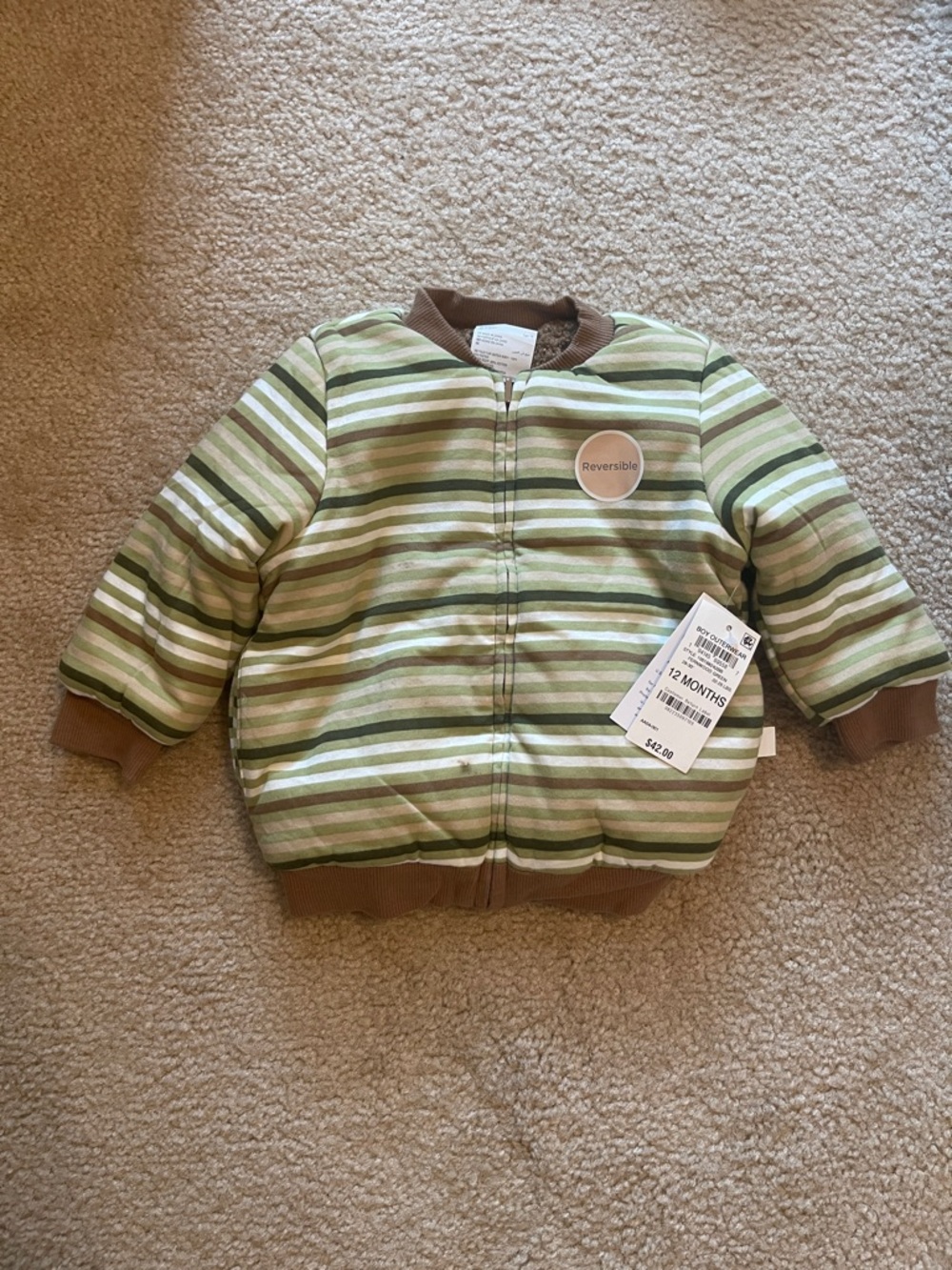 First Impressions Green Striped Reversible Baby Jacket small mark on front
